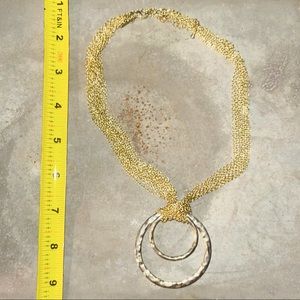 Multi-strand gold-tone necklace.